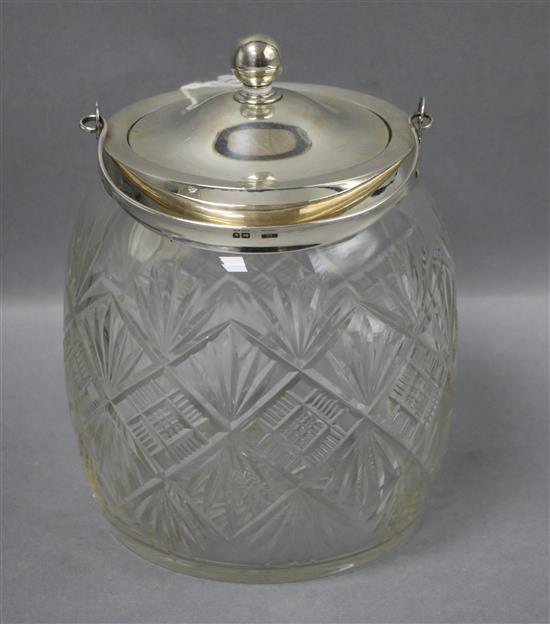 An Edwardian silver mounted cut glass biscuit barrel, John Grinsell & Sons, London, 1902, 19cm.